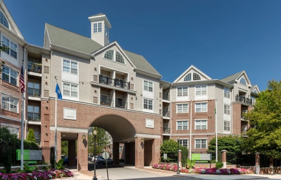 Building exterior with the road passing under an archway at Sofi Parc Grove in Stamford, Connecticut