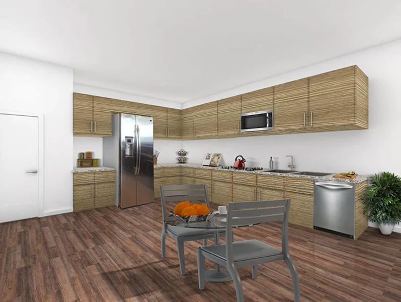 Kitchen with refrigerator and wooden flooring at The Huntington in Morgan Hill, California