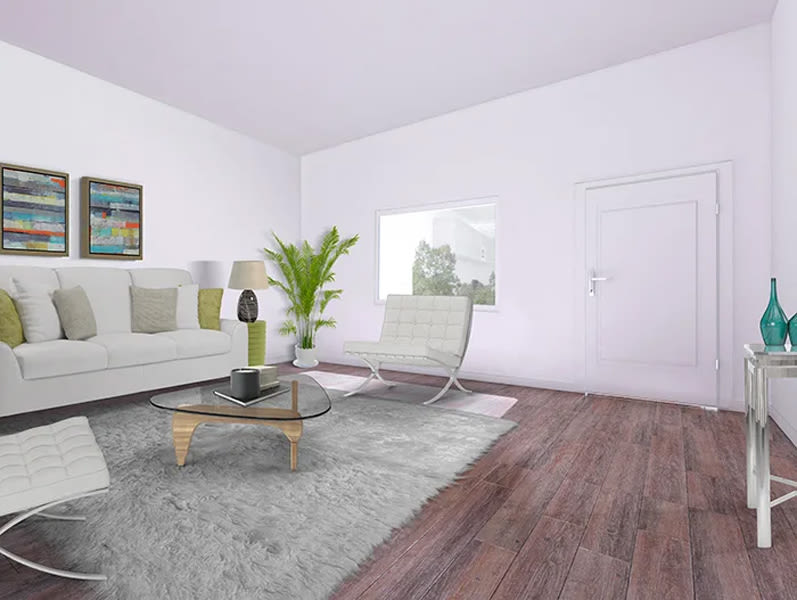 Spacious living room with carpet at The Huntington in Morgan Hill, California