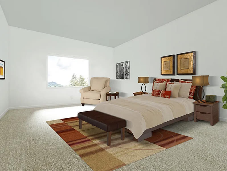 Bright bedroom with window and carpet at The Huntington in Morgan Hill, California