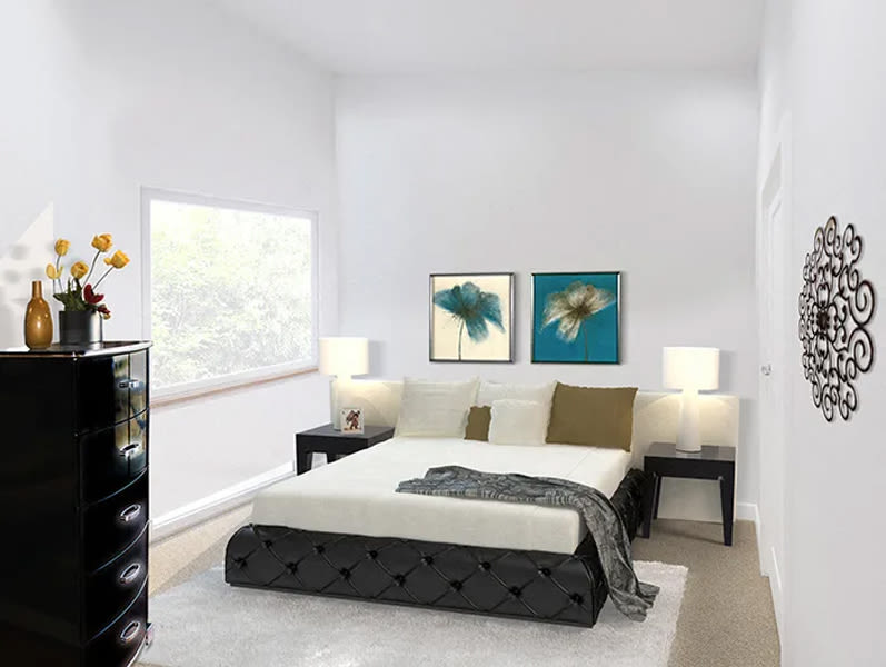 Brightly colored bedroom with large window at The Huntington in Morgan Hill, California