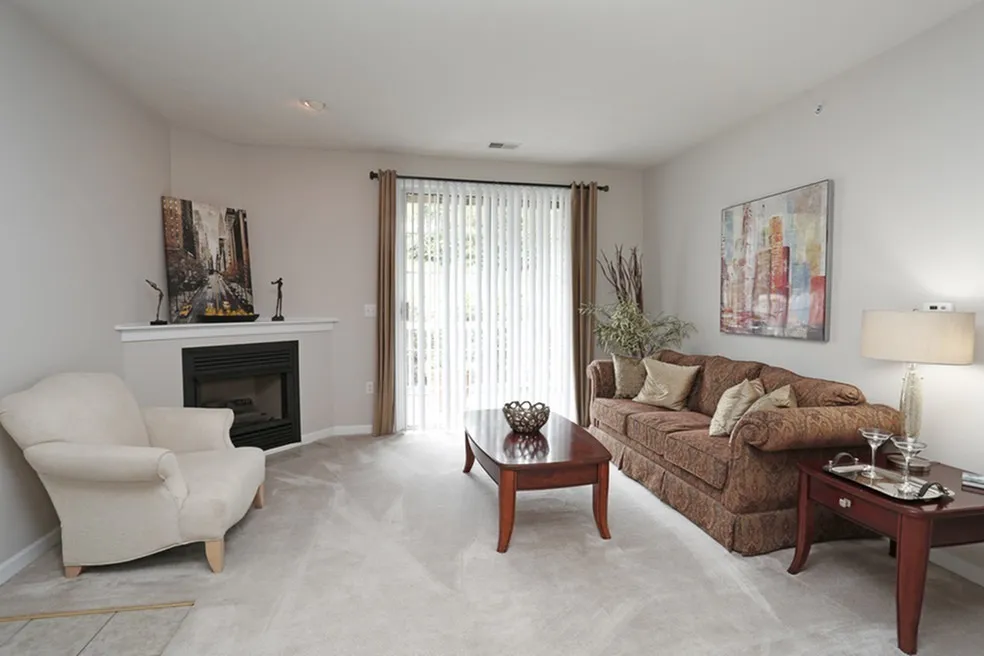 Bright living room with fireplace at Ventana Hills in Coraopolis, Pennsylvania
