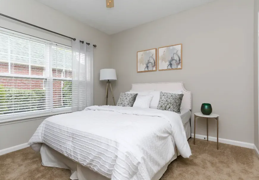 Bedroom with large comfortable bed and a window at Colts Run in Lexington, Kentucky
