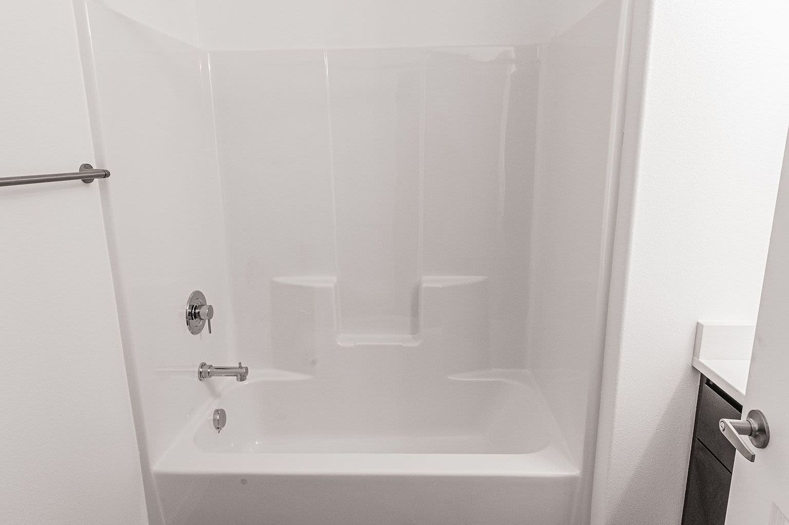 A clean white bathroom with modern shower at Pine View in La Pine, Oregon