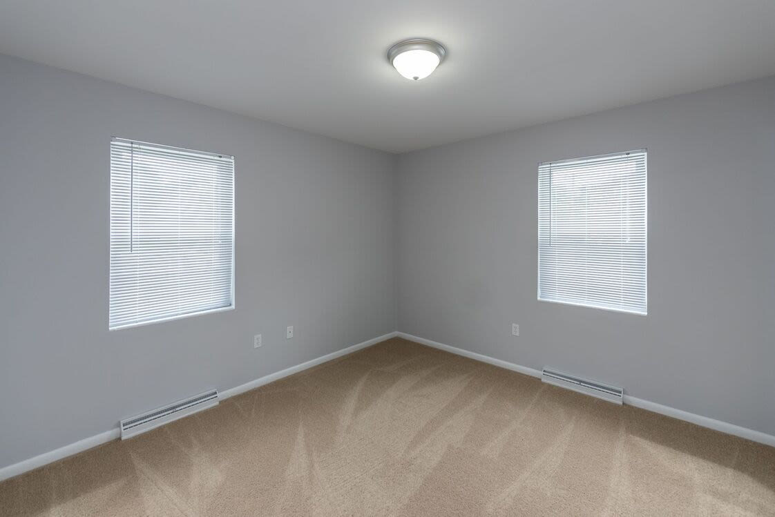 Apartment room with carpet flooring at Signal Hill Apartments in Mechanicsville, Virginia