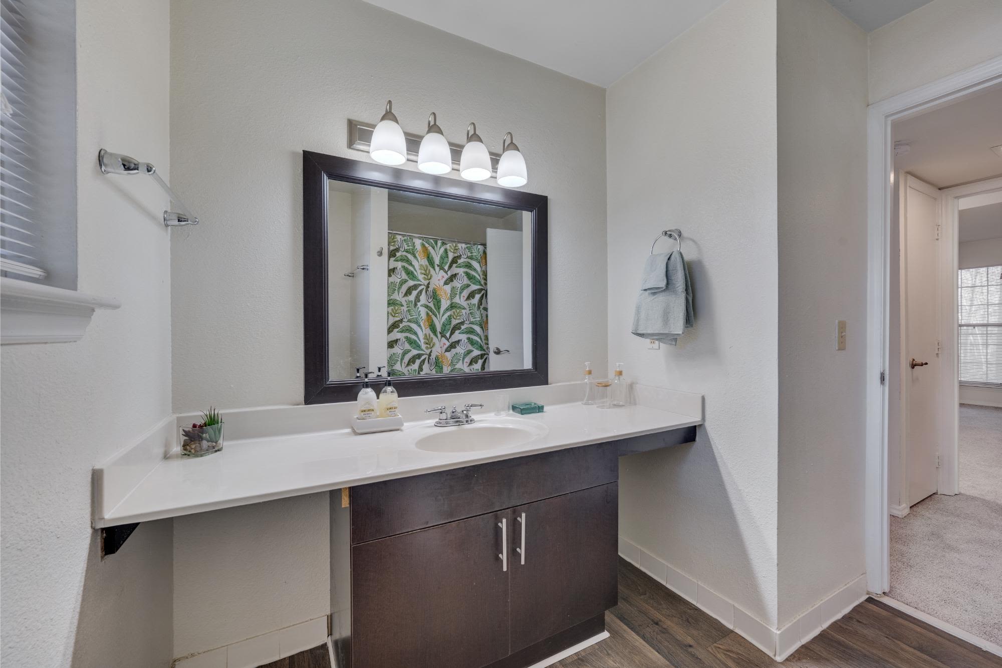 Bathroom with a stylish vanity unit at Trailwood Crossing Apartments in Raleigh,North Carolina