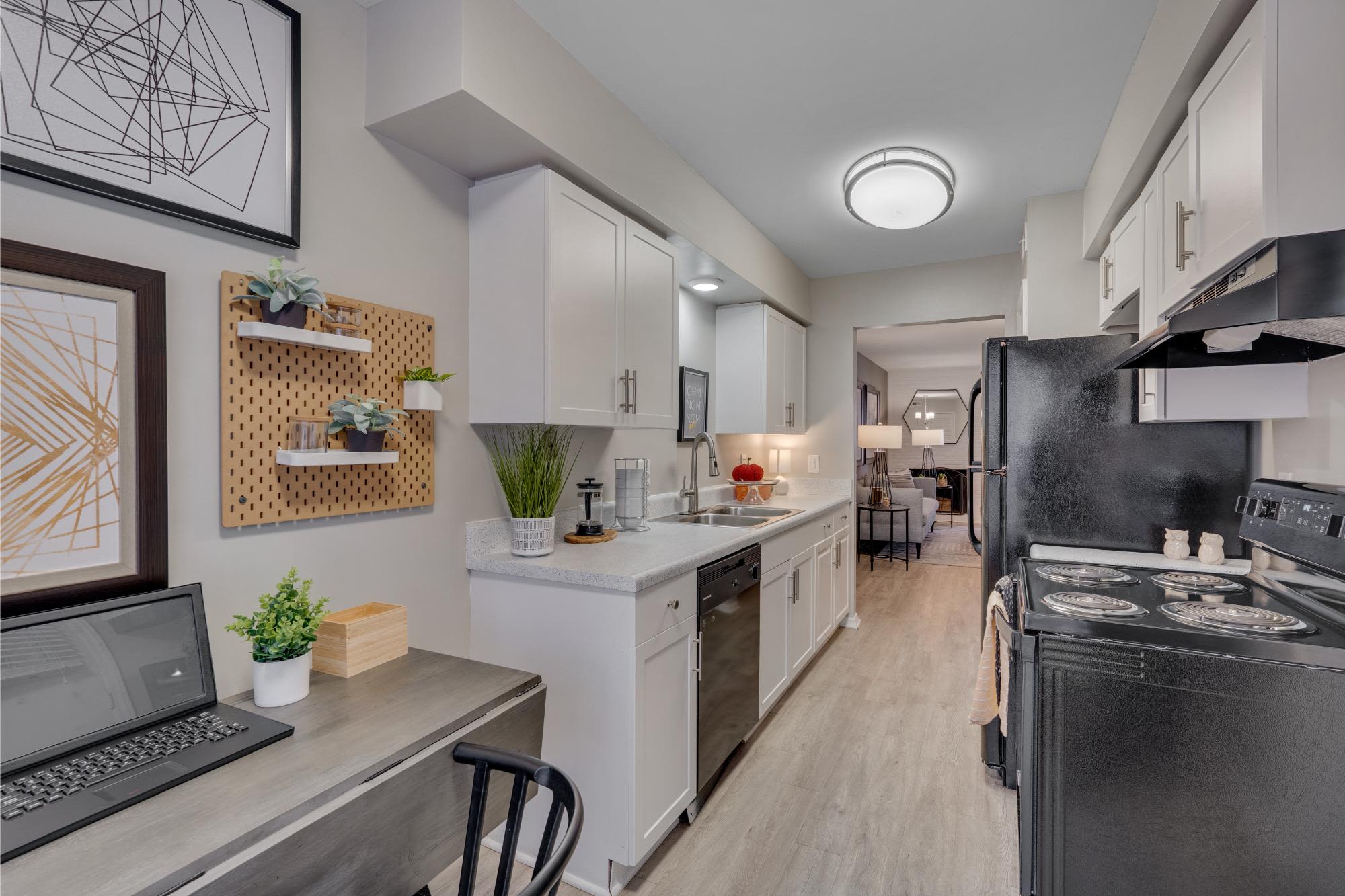 Dining room and kitchen in apartment at Trailwood Crossing Apartments, Raleigh, North Carolina