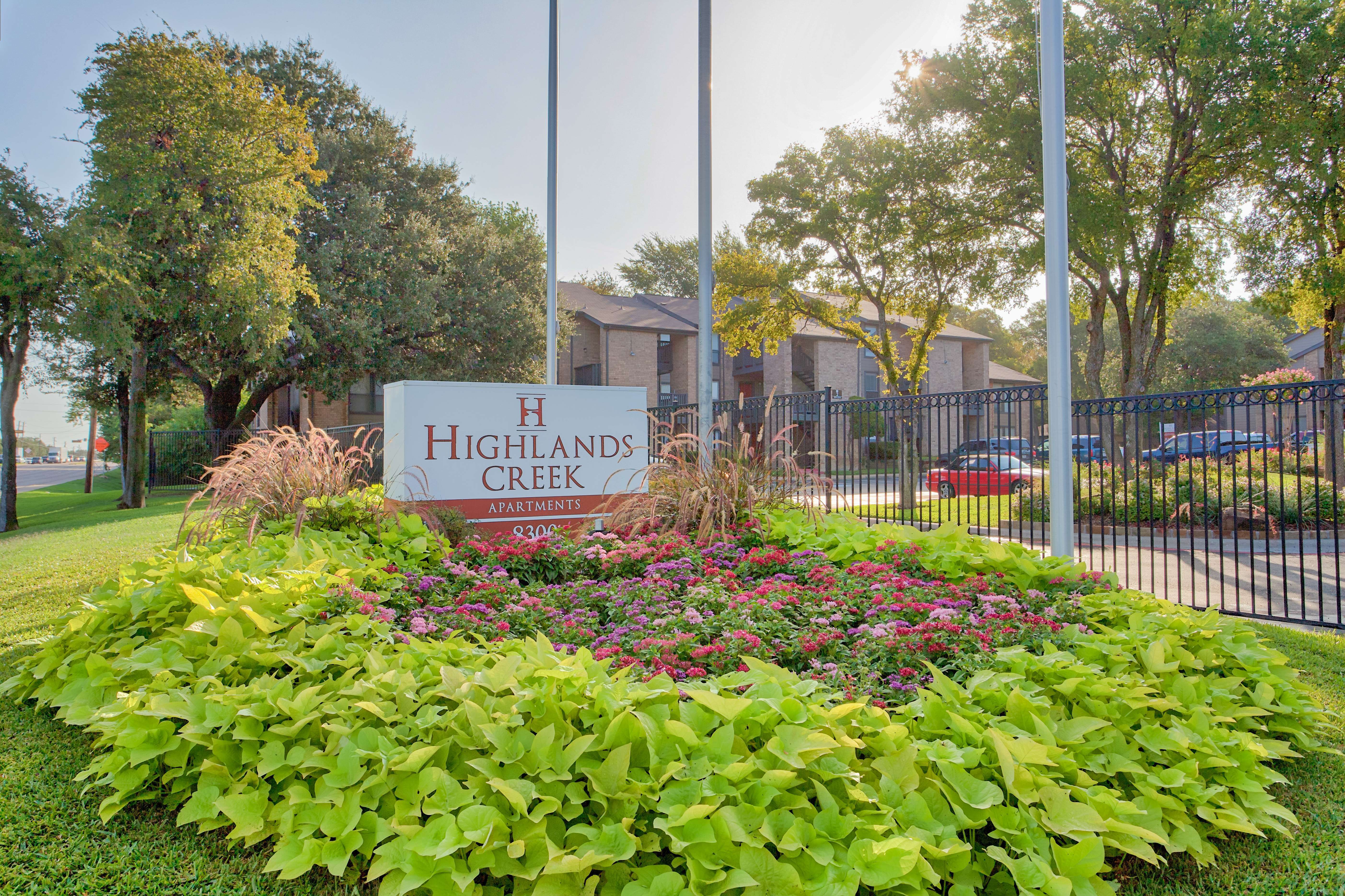 Property exterior with signage at Highlands Creek Apartments in Dallas,Texas