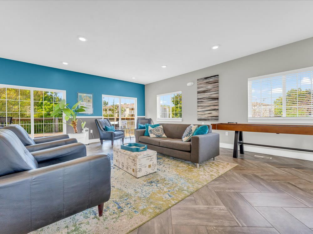 Spacious living room with wooden flooring near Timber View Apartments in Grand Haven, Michigan