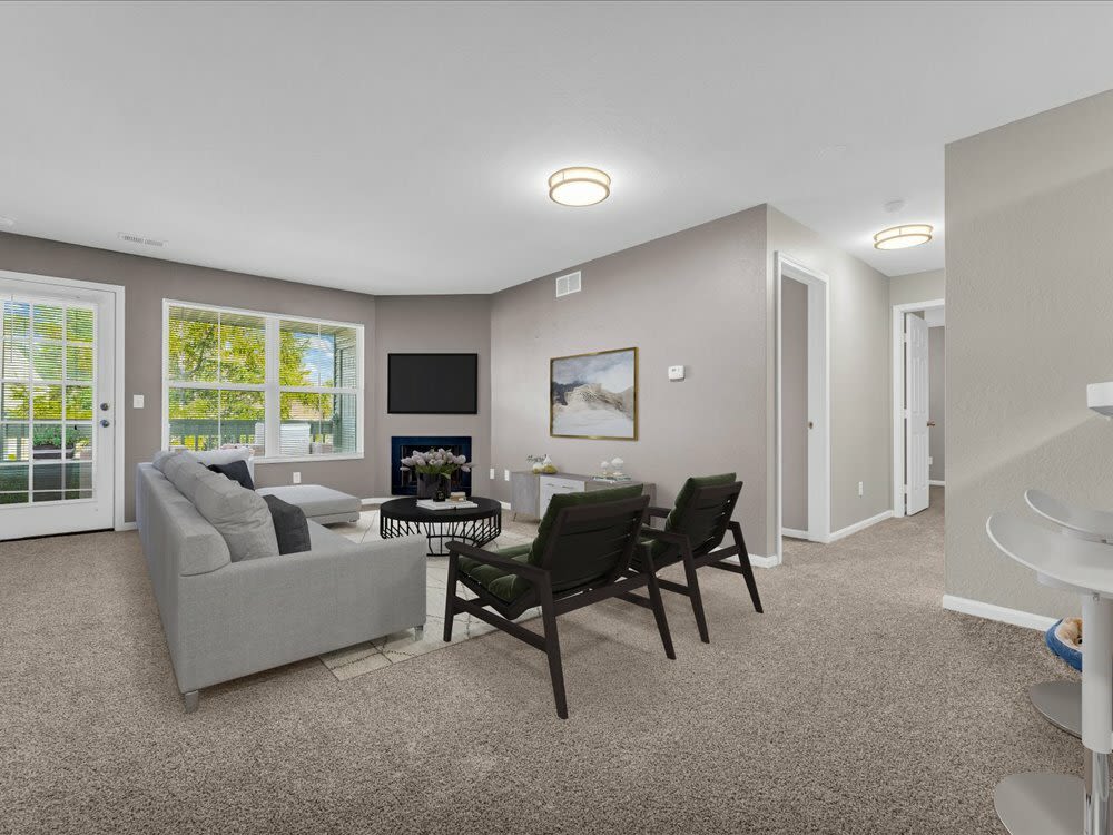 A spacious living room with efficient lighting at Wyndham Hill in Grand Rapids, Michigan