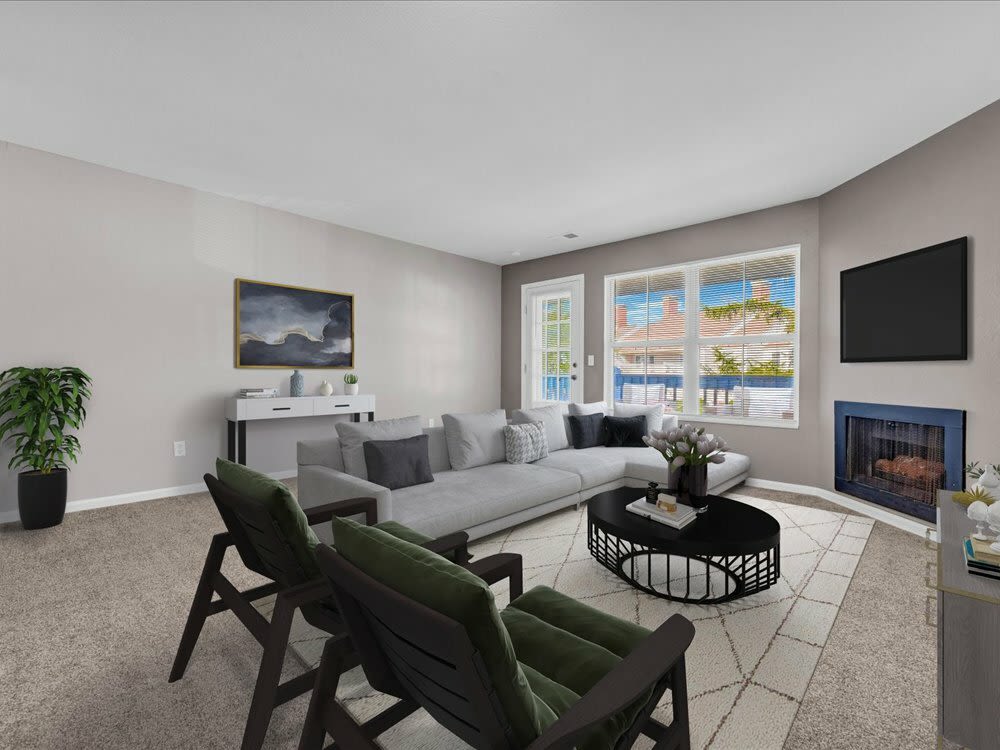 A view of living room with comfortable seating at Wyndham Hill in Grand Rapids, Michigan