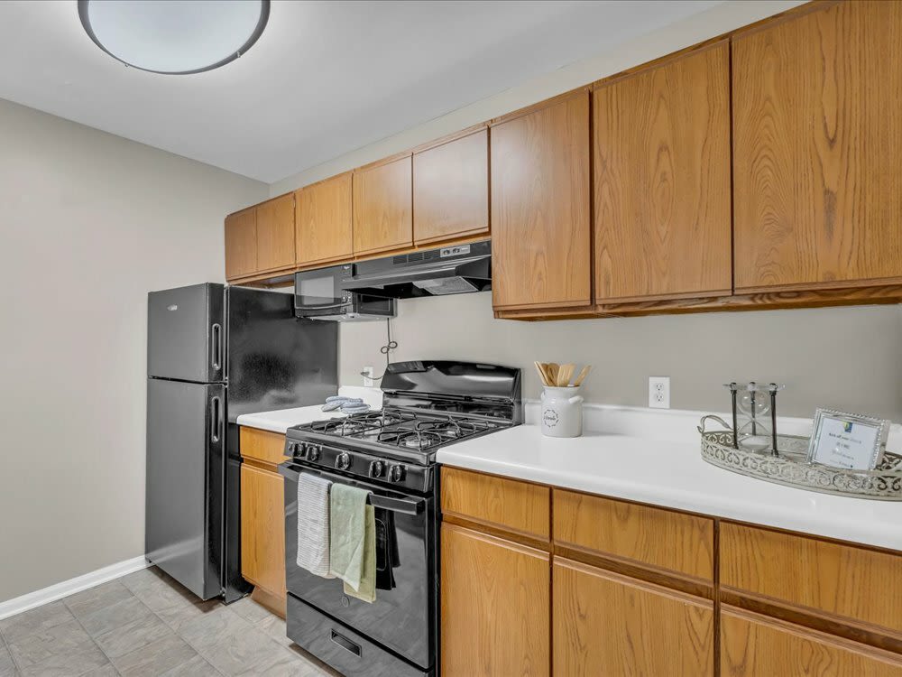 View of kitchen with amenities and lights at Wyndham Hill in Grand Rapids, Michigan