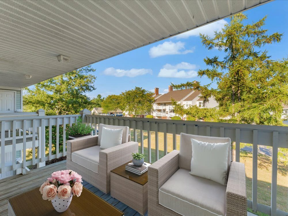 Balcony with seating at Wyndham Hill in Grand Rapids, Michigan