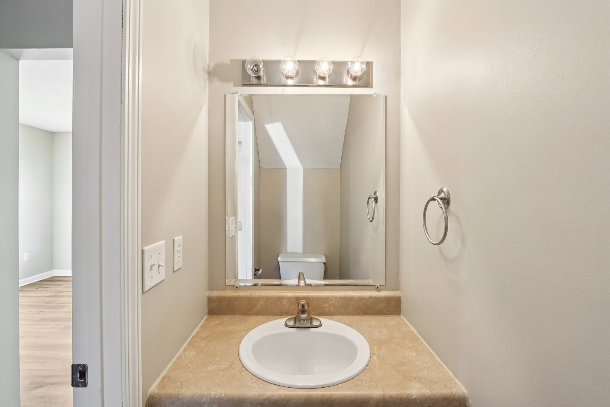 Bathroom with vanity lights at Fox Pointe Apartments in Columbus, Indiana
