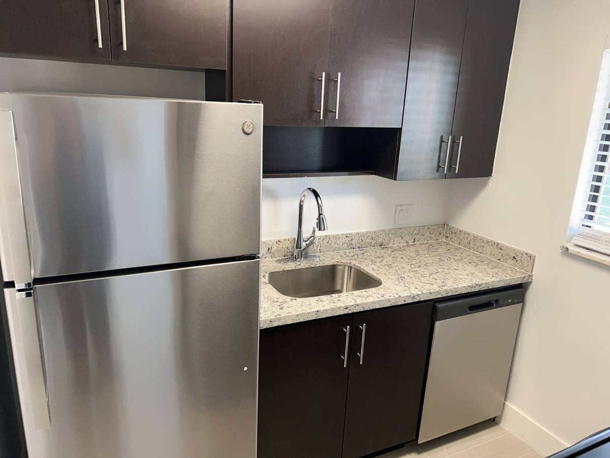 Kitchen room with modern appliances at Banyan Club East in Pompano Beach, Florida