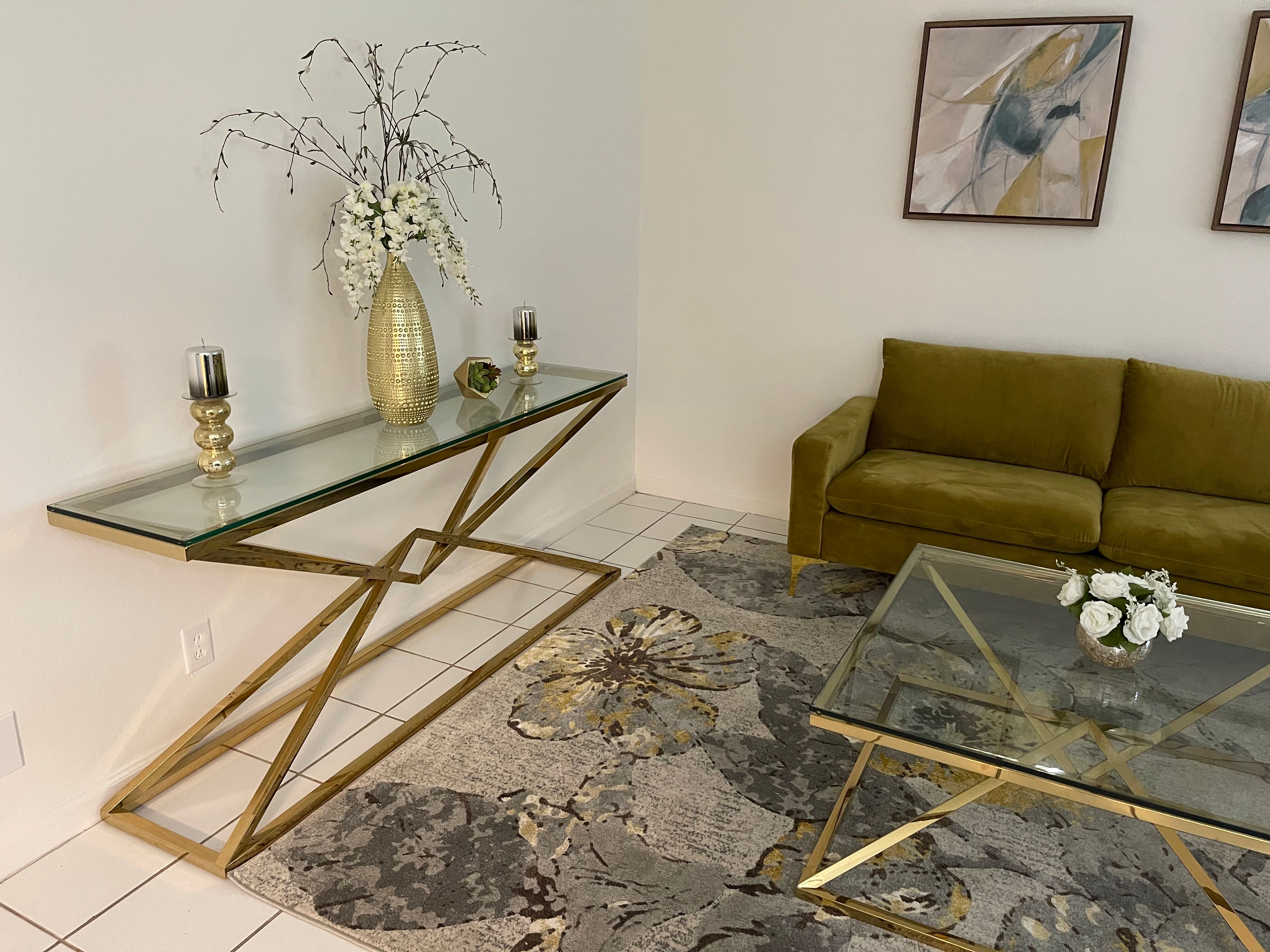 Living room showing couch and coffee table at Banyan Club East in Pompano Beach, Florida