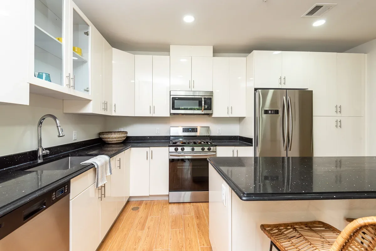 Kitchen showing modern stainless steel appliances at The Sto at Stoughton in Stoughton, Massachusetts