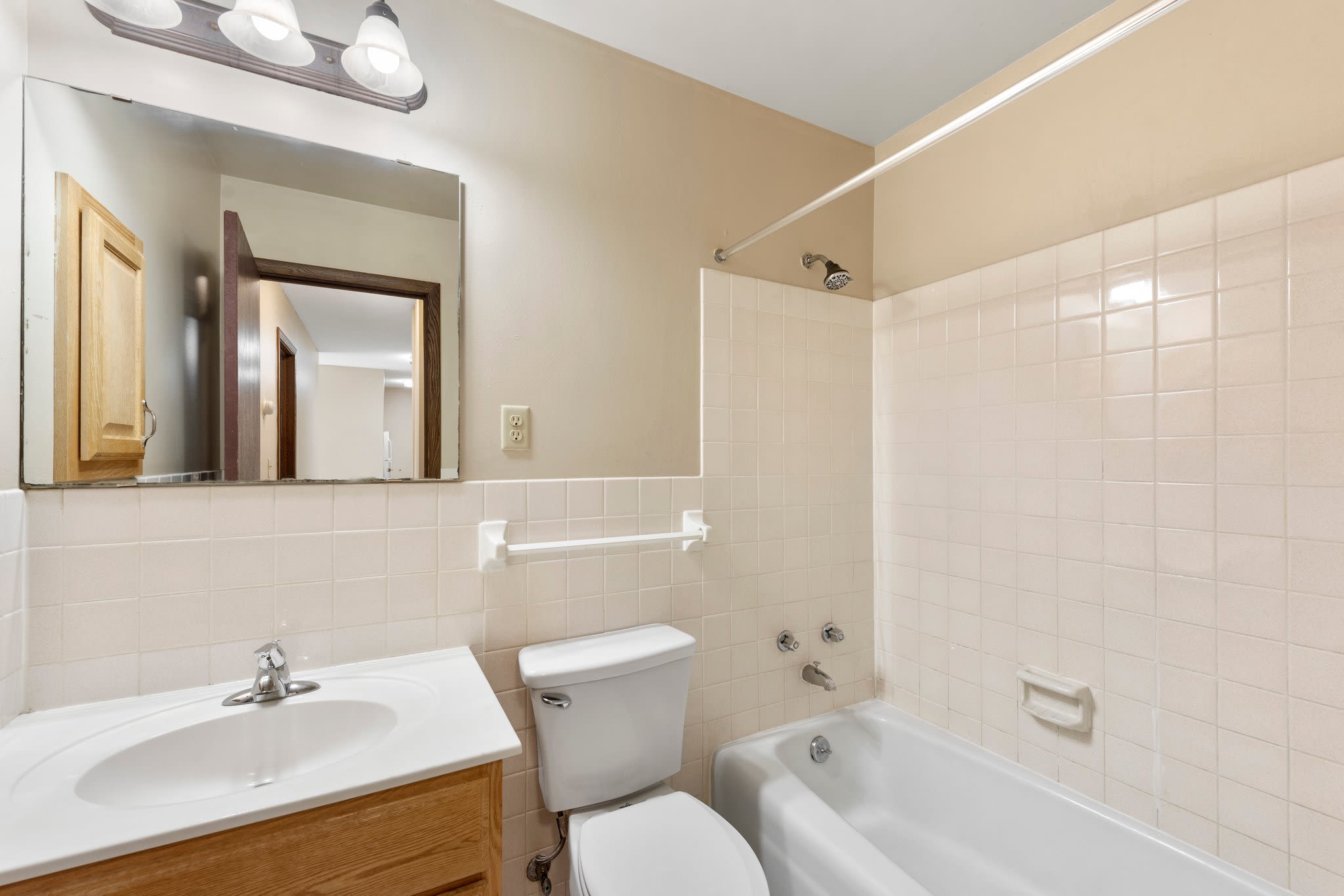 Bathroom with bathtub at Shamrock Court Apartments in Saint Paul, Minnesota