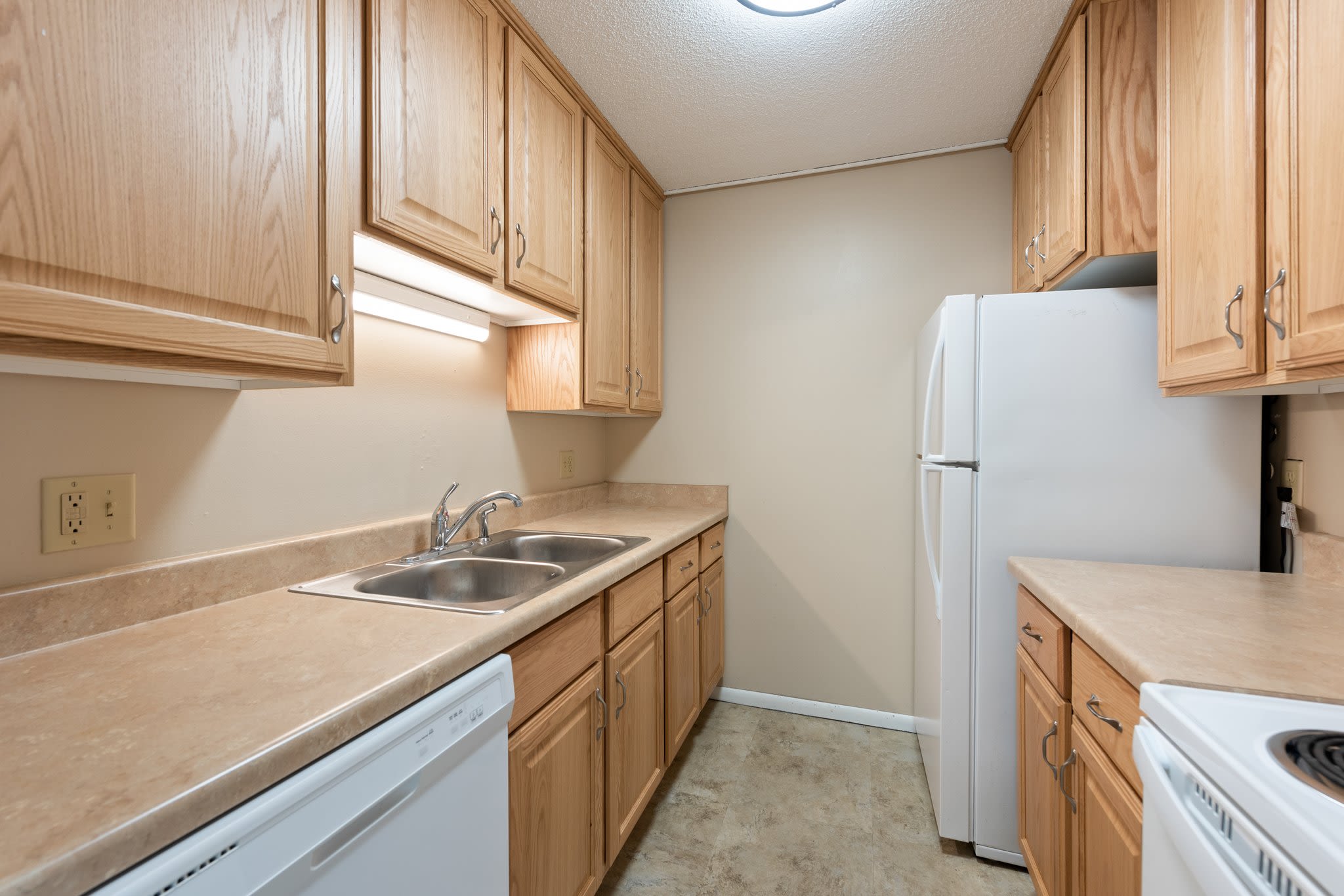 Kitchen with tile flooring at Shamrock Court Apartments in Saint Paul, Minnesota