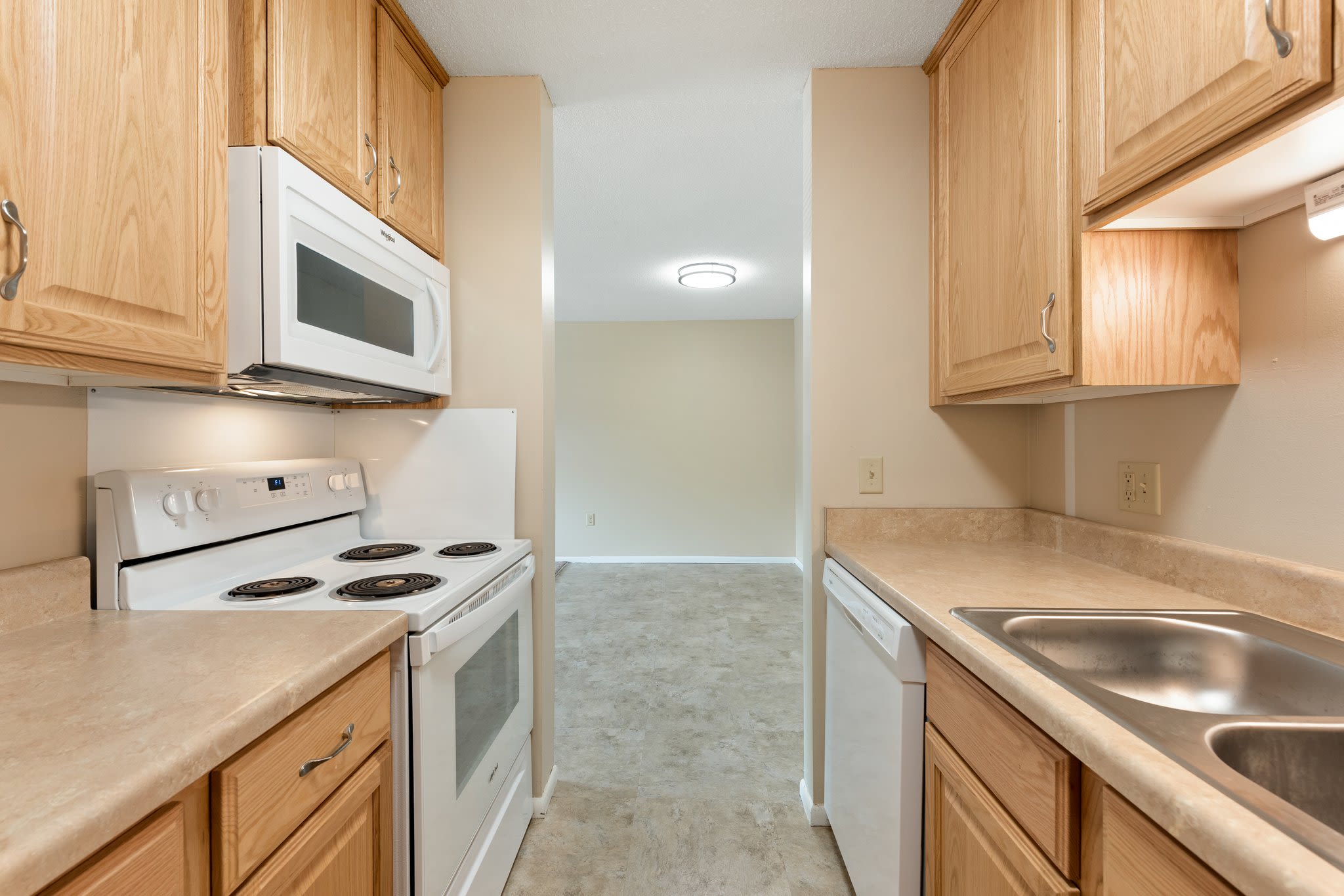 Kitchen with dishwasher at Shamrock Court Apartments in Saint Paul, Minnesota