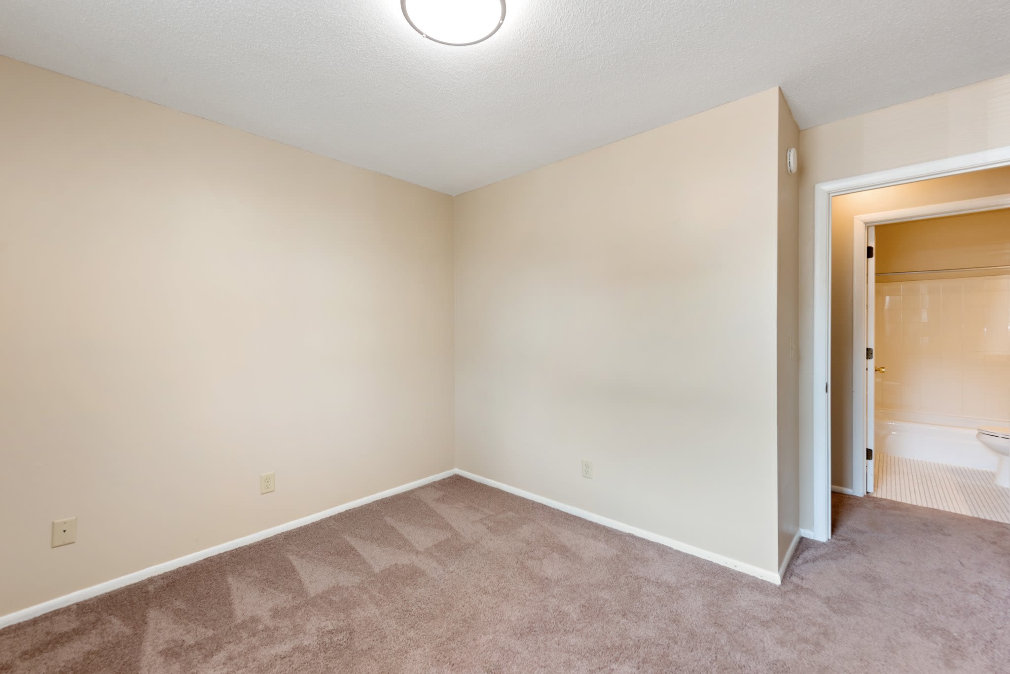 Unfurnished bedroom with carpet floor at Shamrock Court Apartments in Saint Paul, Minnesota