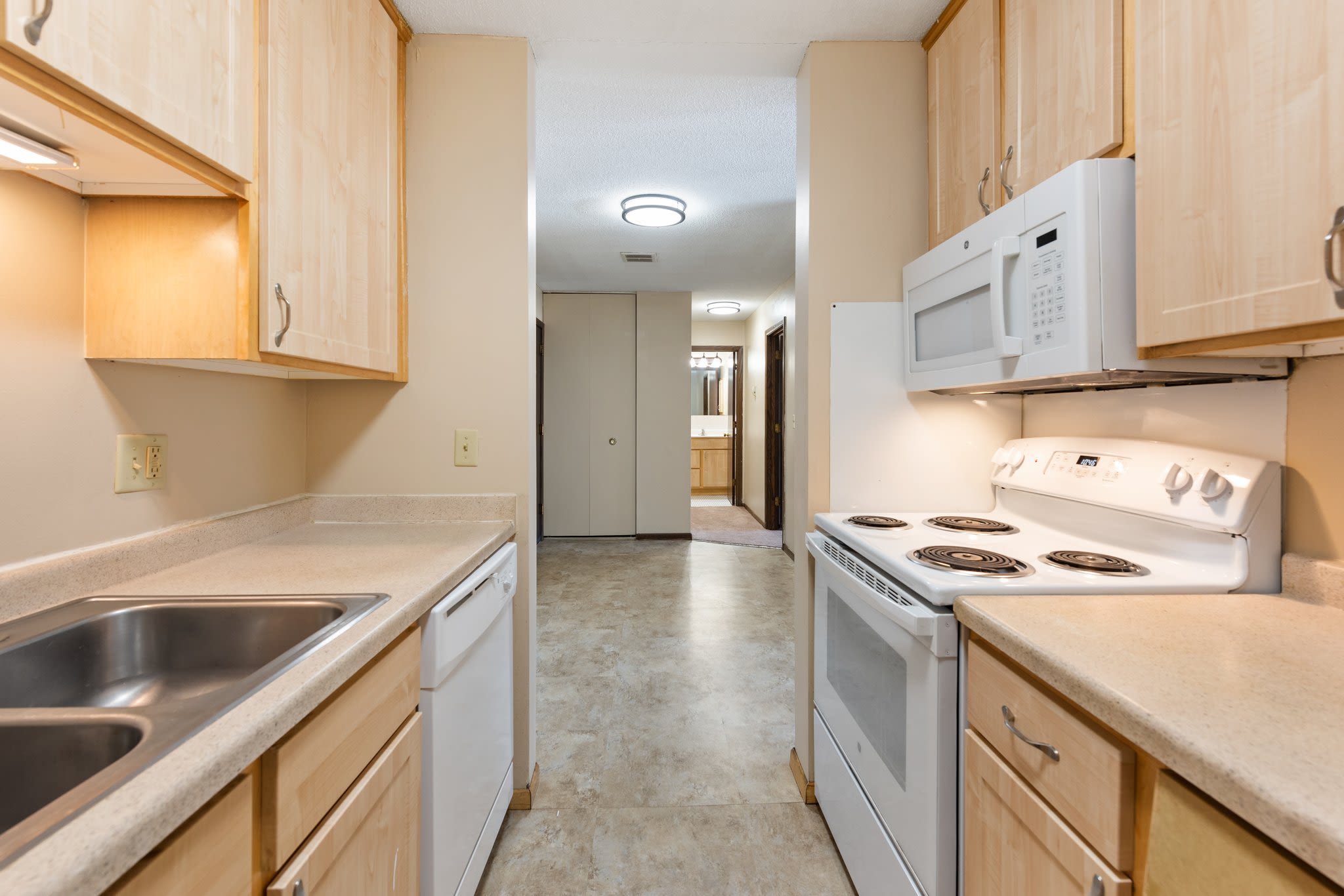 Kitchen showing wooden cabinets at Shamrock Court Apartments in Saint Paul, Minnesota