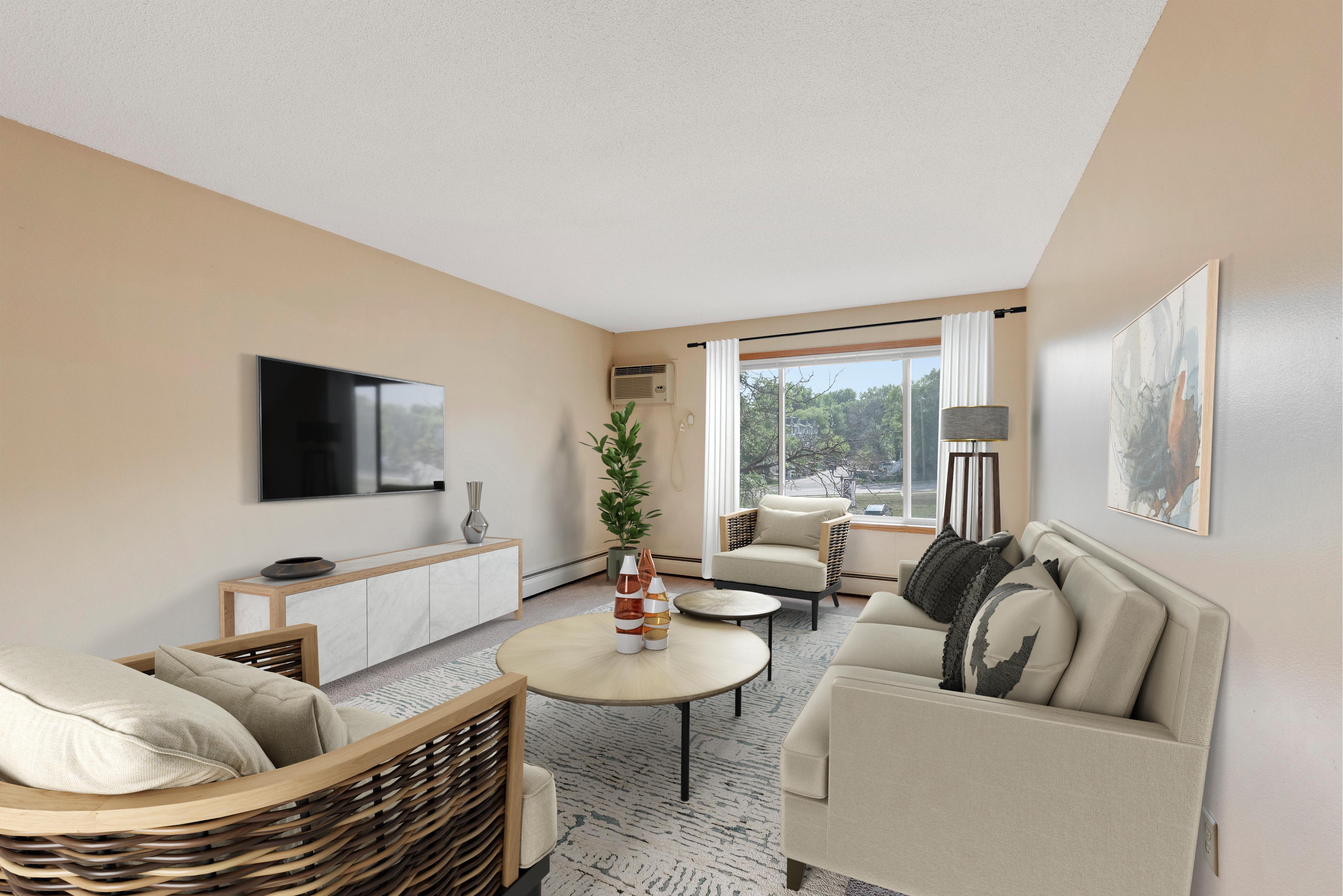 A view of the living room with couch and coffee table at Shamrock Court Apartments in Saint Paul, Minnesota