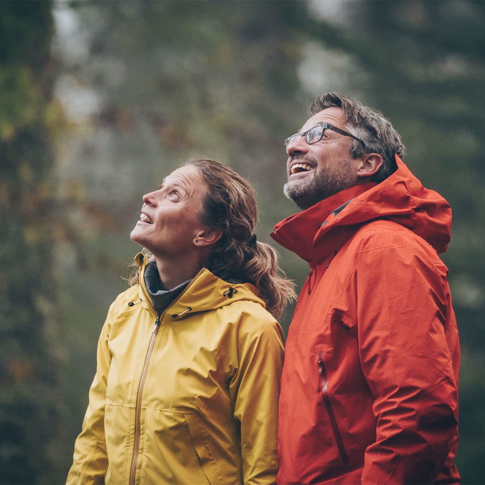 Resident couple on a nature walk through a redwood forest near Mission Rock at San Rafael in San Rafael, California