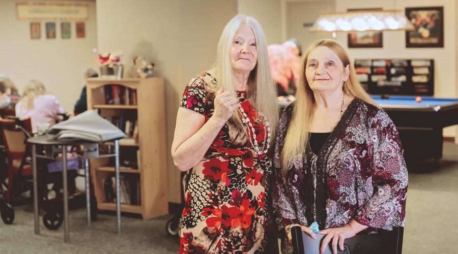 Resident friends posing for a picture at Peoples Senior Living in Tacoma, Washington