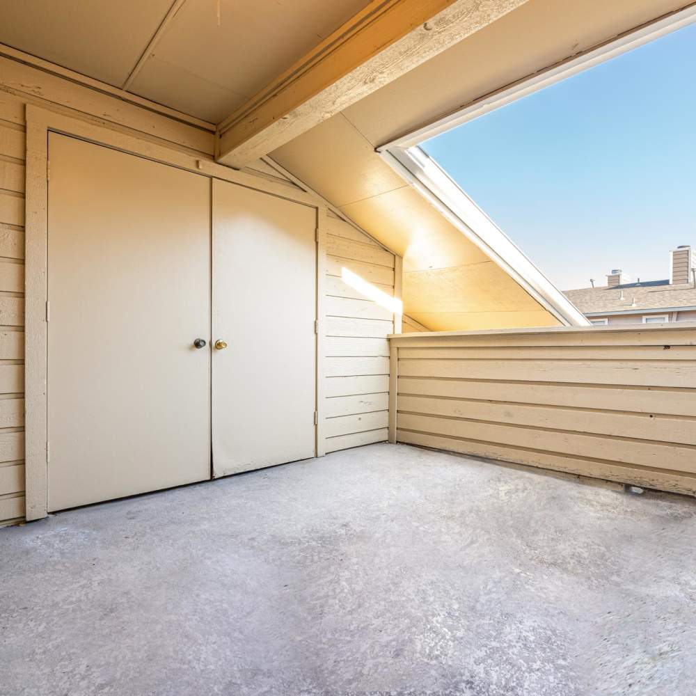 Double doors on a balcony with sloped ceiling at The Camaron Townhomes & Flats in San Antonio, Texas