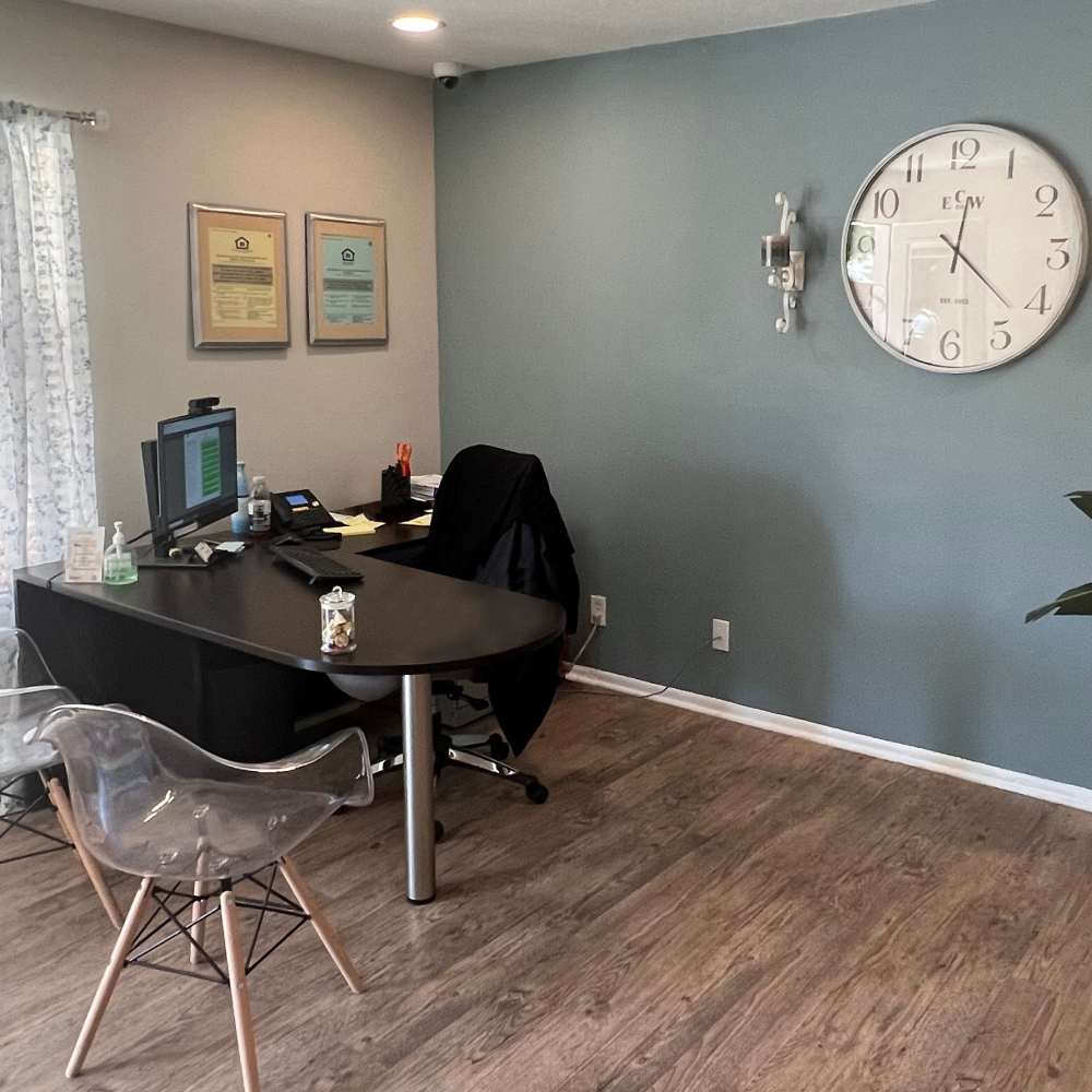 Desk with computer and office supplies at The Camaron Townhomes & Flats in San Antonio, Texas