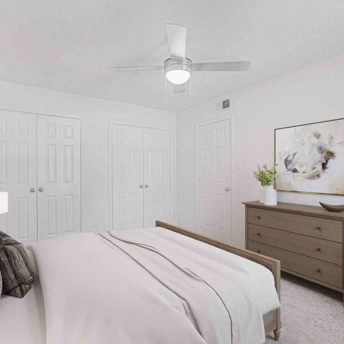 Bright bedroom with modern decor at Crescent Place in Savannah, Georgia