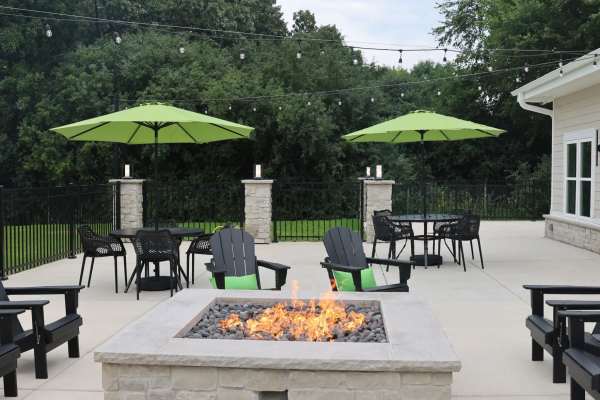 Fire pit area with seating at Pritchard Park Place in Racine, Wisconsin