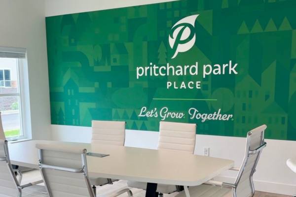 Modern conference room with white chairs at Pritchard Park Place in Racine, Wisconsin