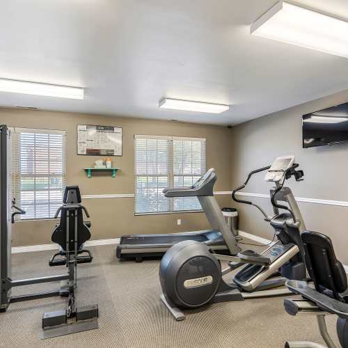 Elliptical machine and treadmill in gym at Indian Footprints Apartments in Harrison, Ohio
