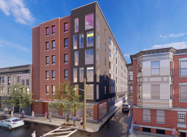 Modern brick facade with large windows near Fourth at Broadway in Chelsea, Massachusetts