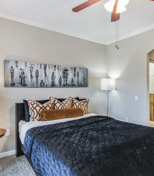 Cozy bedroom with a king-size bed at Vintage Park in Houston, Texas