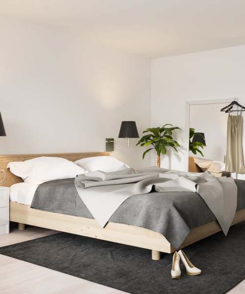 Bedroom with bright lighting at Diggs Circle Townshomes in La Plata, Maryland