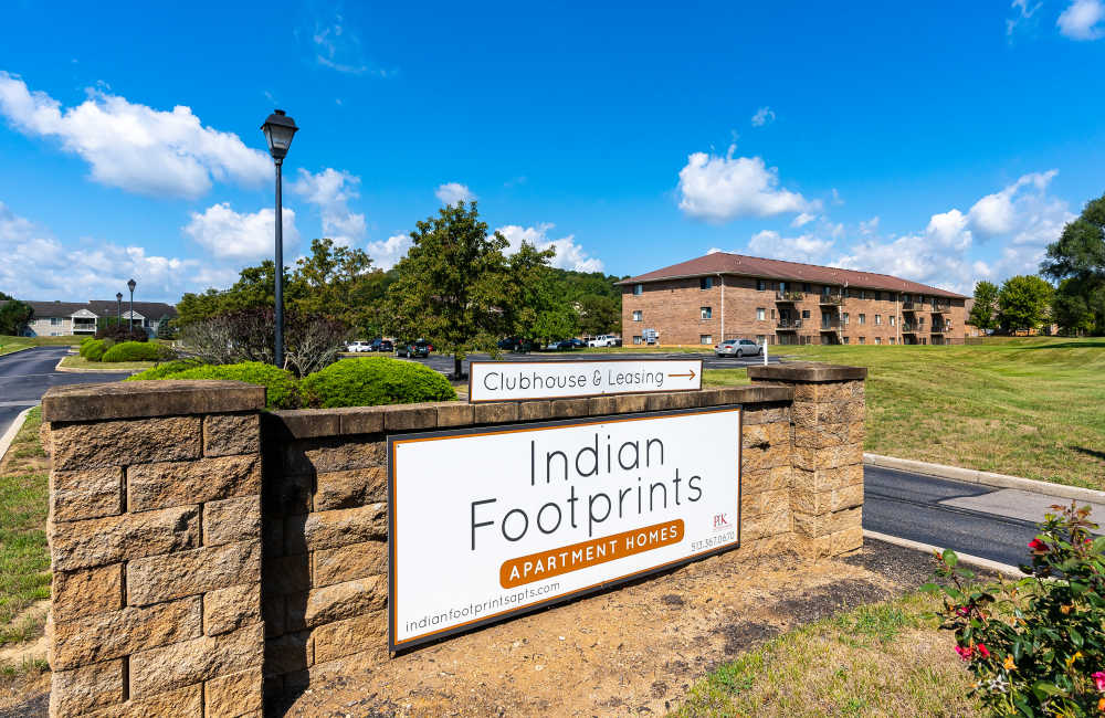 Sign displaying clubhouse and leasing information at Indian Footprints Apartments in Harrison, Ohio