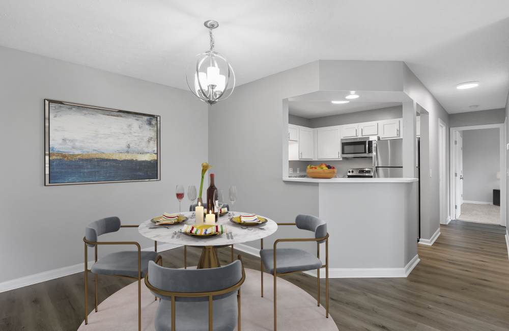 Round dining table with four chairs at Indian Footprints Apartments in Harrison, Ohio