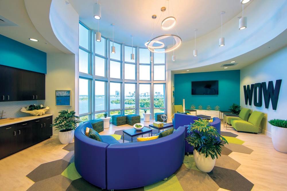 Lounge area with modern seating and views at Bayview Student Living in North Miami, Florida