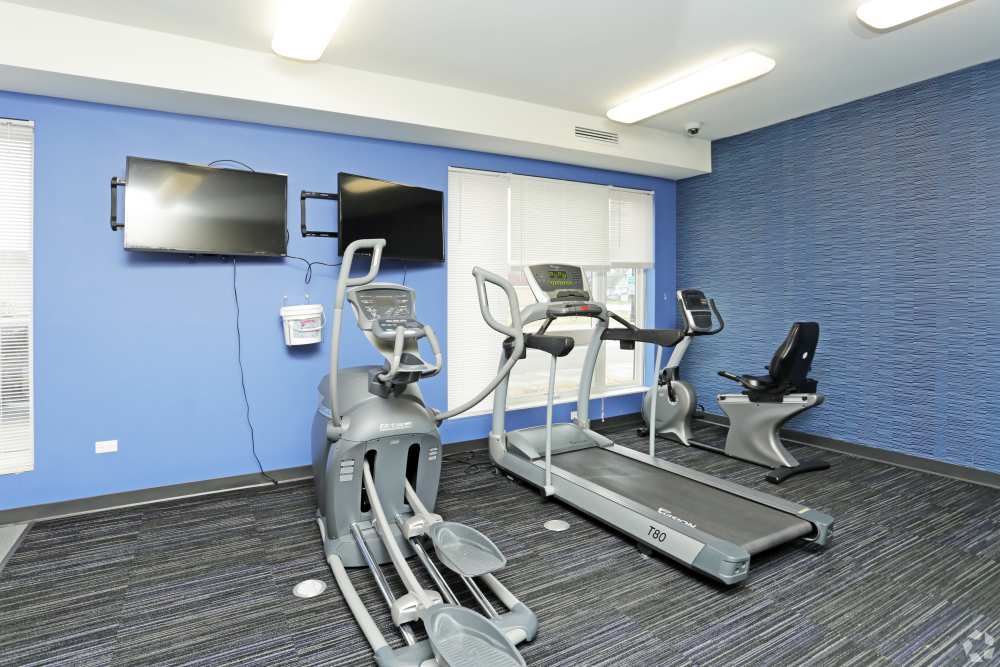 Fitness center with treadmill, elliptical at Harrison Lofts in Davenport, Iowa