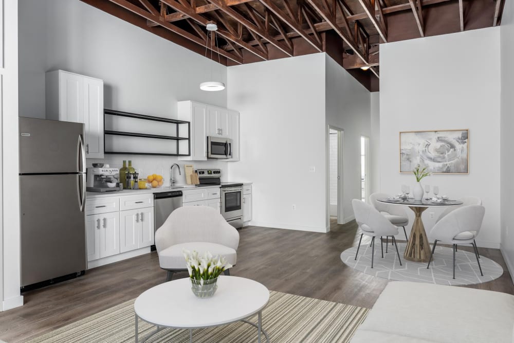 White dining table with four chairs at Brush Factory Lofts in Philadelphia, Pennsylvania