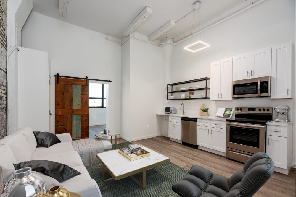 Exposed brick wall with wooden sliding door at Brush Factory Lofts in Philadelphia, Pennsylvania