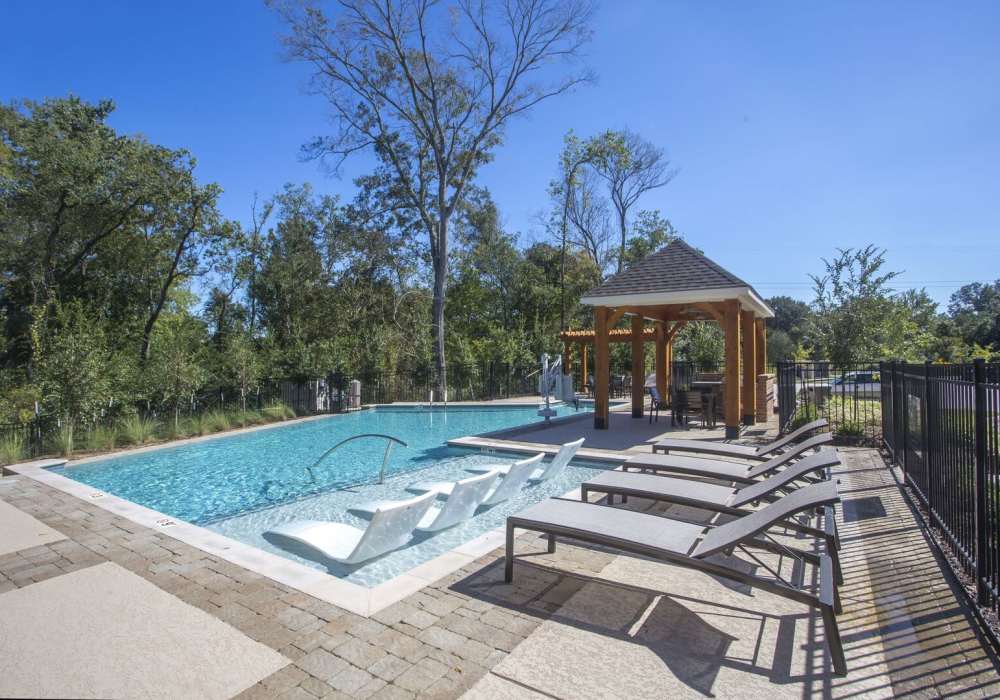 Pool with lounge chairs at Lakeside Villas in Baton Rouge, Louisiana