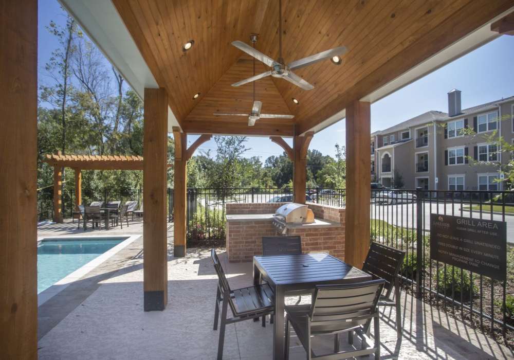 Relaxing community area with pool beside at Lakeside Villas in Baton Rouge, Louisiana