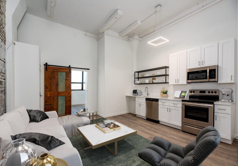 Exposed brick wall with large window at Brush Factory Lofts in Philadelphia, Pennsylvania