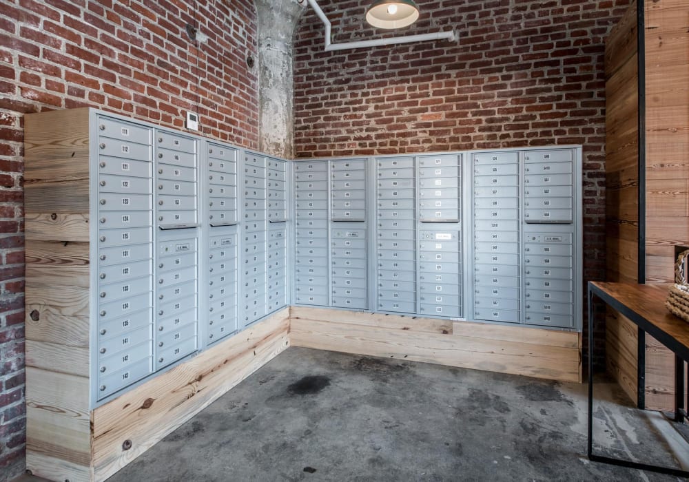 Mailboxes arranged against a brick wall at Brush Factory Lofts in Philadelphia, Pennsylvania