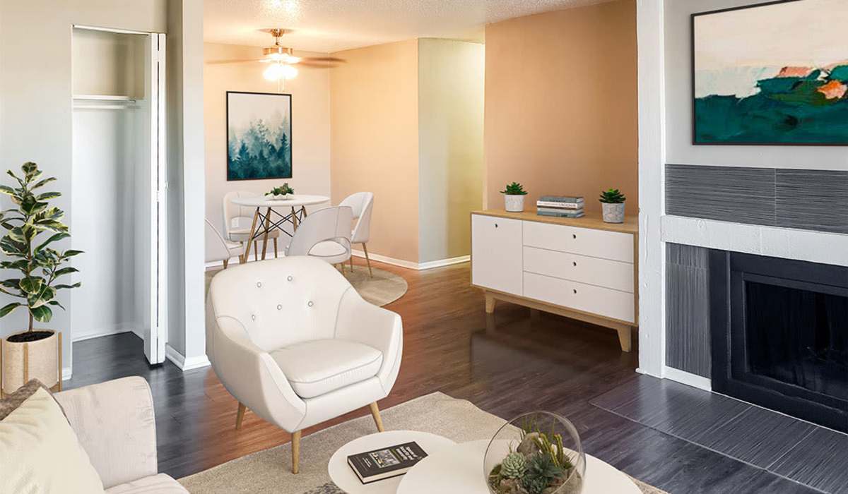 Open layout living room with hardwood flooring and modern furniture at Riatta Ranch Apartments in Abilene, Texas