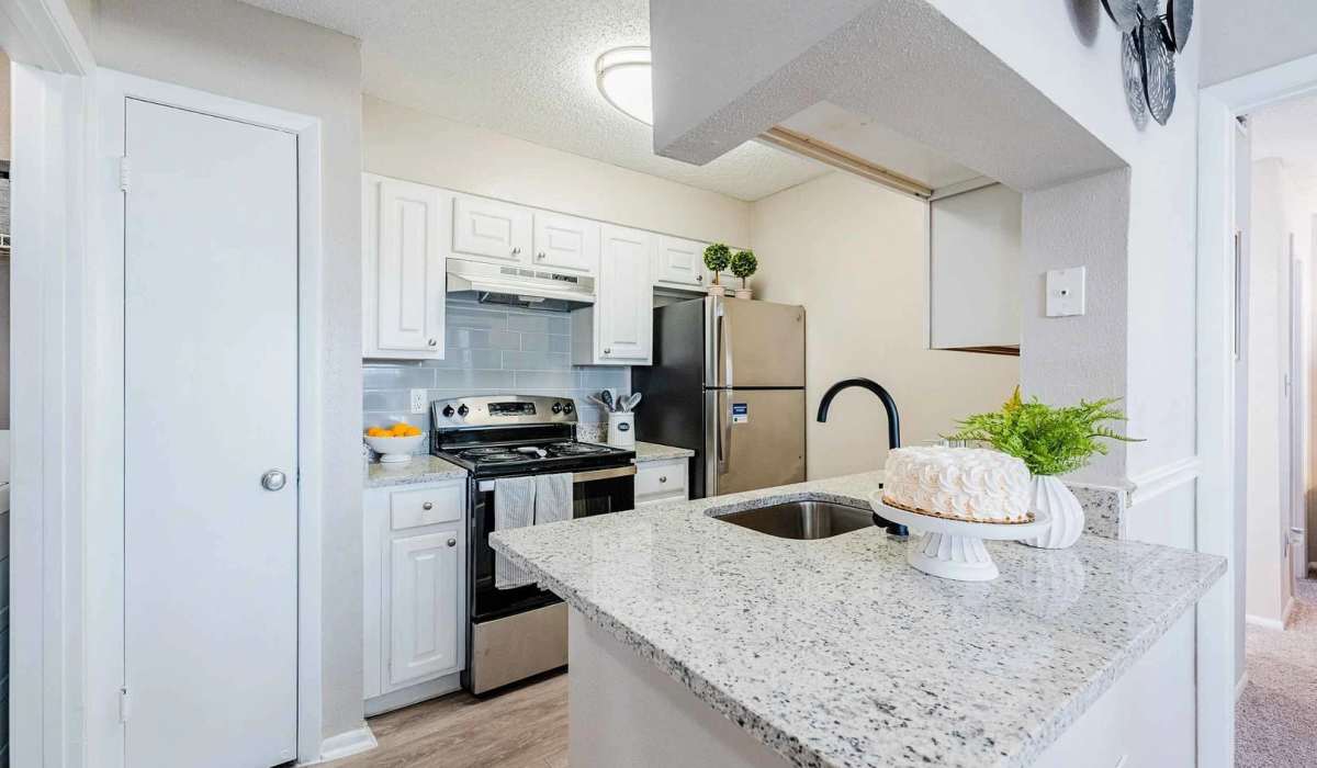 Kitchen with granite countertop at The Park at Via Veneto in Jacksonville,Florida
